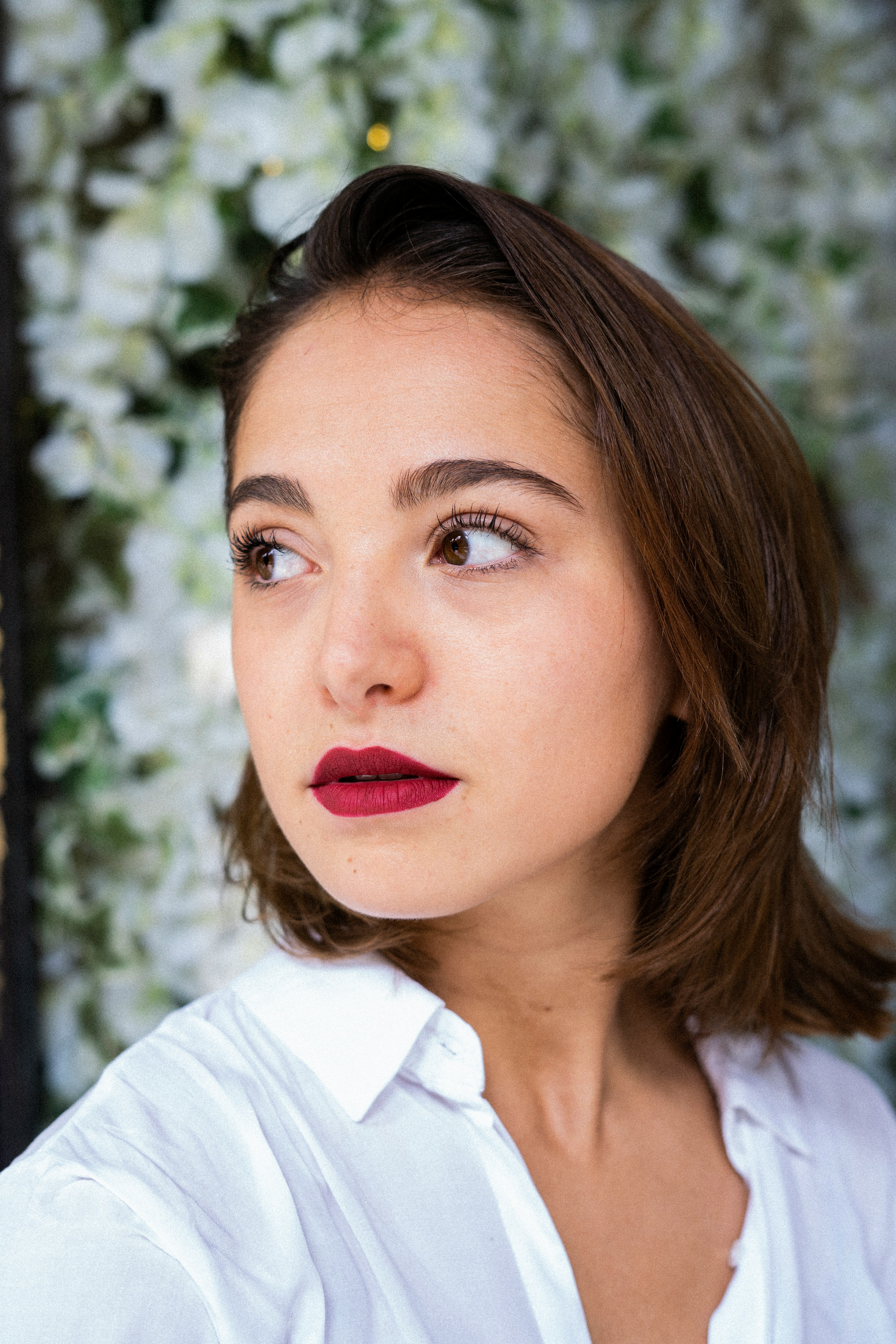 woman in white shirt with red lipstick